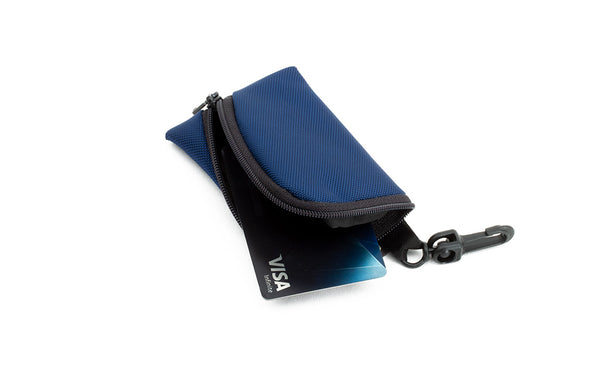 An open Super Mini Ghost Whale Pouch holding a credit card.